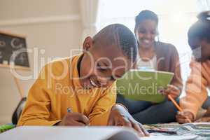 Finally I feel like I understand. a young boy completing his school work at home.