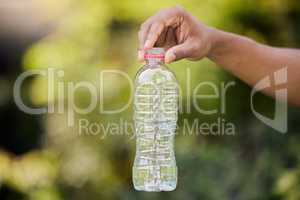 Ban the bottle. an unrecognisable person picking up litter at a park.