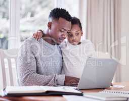 Family knows your flaws but loves you, anyway. a young man working while caring for his adorable baby girl at home.