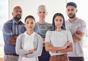 We will remain strong and unconquerable. a group of businesspeople standing together in an office.