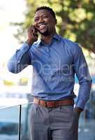 Im excited to see you. a young businessman using his smartphone to make a phone call outside.
