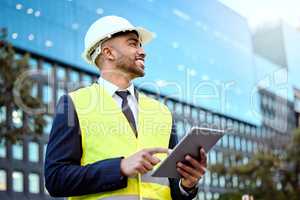 Get your metrics right. a young businessman on a construction site using a digital tablet.