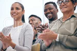 That deserves an applause. a group of businesspeople clapping hands in a meeting at work.