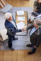 I look forward to doing more business with you. Aerial shot of two senior businessmen shaking hands.