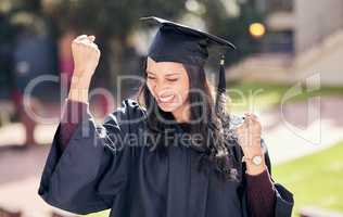 All it takes is perseverance. an attractive young female student celebrating on graduation day.