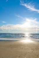 Beautiful, calm and quiet view of the beach, ocean and sea against a cloudy blue sky copy space background on a sunny day. Peaceful, scenic and tranquil landscape to enjoy a relaxing coastal getaway