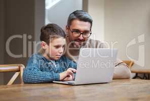Focus and itll make sense. a father and son team using a laptop to complete school work.