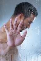 Peace has not price tag, thats the catch. Studio shot of a handsome young man washing his hair in a shower against a grey background.