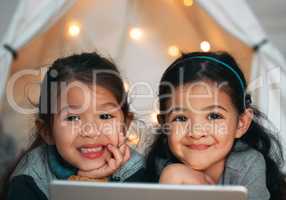 A sister is a friend wholl always have your back. two sisters using a digital tablet at home.