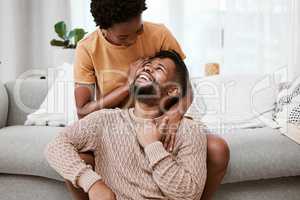 She knows just how to make me smile. a young couple relaxing at home.