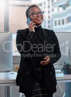 Accept who you are and revel in it. a young woman using a cellphone in the office.