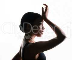 If you have it, flaunt it. Silhouette shot of a beautiful young woman posing against a white background.