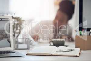 In order to be successful you need to be persistent. a young businesswoman working at her desk.