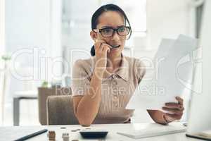 Bad budgeting can lead to more financial stress. a young businesswoman looking stressed out while calculating finances in an office.