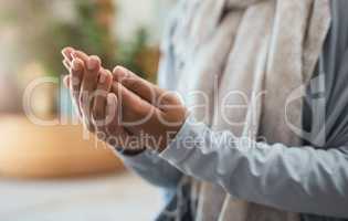 Prayers outlive the lives of those who uttered them. an unrecognizable woman praying at home.