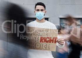 Remember to do whats best for you. a young man holding a placard at a covid vaccine protest.