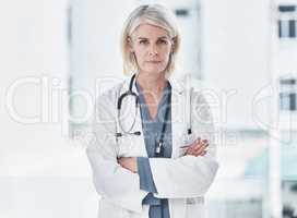 Illness is tough, but Im tougher. Portrait of a confident mature doctor working at a clinic.