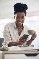 Taking a coffee break is instrumental to health. a businesswoman using her smartphone to send text messages while drinking coffee.