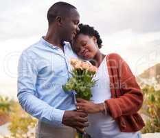 Were grateful for each other every day. a handsome young man surprising his pregnant wife with roses during a day at home.