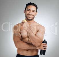 Keep doing whats best for you. a man standing against a grey background while holding a bottle of water and an apple.