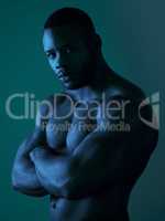 Go on, you can stare. Portrait of a handsome young man posing topless in studio.