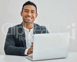 Remember me- the man you thought id never be. Portrait of a businessman using a laptop at his desk in a modern office.