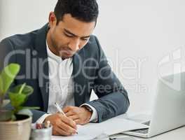 Mega civilian, I wont lead my life riding pillion. a businessman doing paperwork at his desk in a modern office.