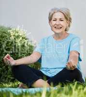 Yoga made me a happy old lady. a senior woman doing yoga outside in her yard.