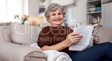 Remember tomorrow that we can look at yesterday. Portrait of an elderly woman looking relaxed on the sofa while reading at home.