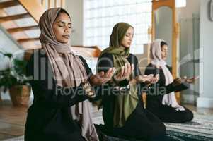 This has been a time of prosperity. a group of muslim women praying together.