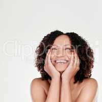 Its silky soft. a beautiful mature woman posing against a grey background in studio.