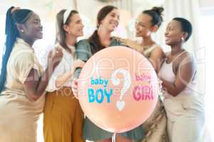 So excited to find out. a group of women about to pop a balloon for a gender reveal during a baby shower.