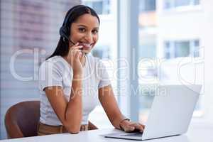 Problem solving is what I do best. Cropped portrait of an attractive young female call center agent working at her desk in the office.