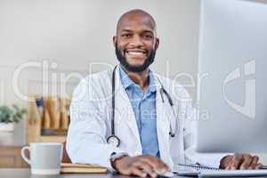 Everyone needs a healthcare professional in their life. a young doctor using a computer at work.