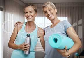 Didnt just kiss the girl, I married her. Portrait of two mature women getting ready for their workout at home.
