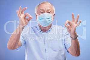Compose a life of longevity. Studio shot of a senior man wearing a face mask against a blue background.