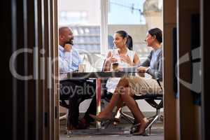 Compiling a compelling concept that works. a group of businesspeople having a meeting in an office.