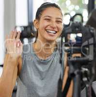 Go confidently in the direction of your dreams. a young woman using a camera to record for her vlog in a gym.