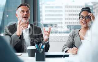 Theyre always thrilled to share their big ideas. a group of businesspeople having a meeting in an office.