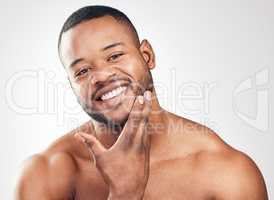 Being well-groomed is a huge confidence booster. Studio portrait of a handsome young man posing against a white background.