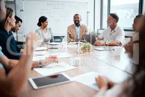 Id really like some stellar presentations form you. a group of staff listening to their boss during a business meeting.