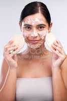 Remove dead skin for smoother skin and clearer pores. Studio shot of a beautiful young woman washing her face.