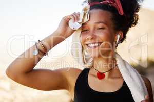 That workout sure felt good. a woman using a towel to dry herself after a workout.