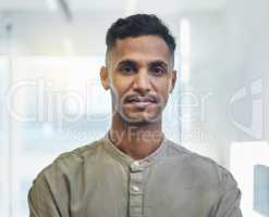 Face any business challenges with confidence. Cropped portrait of a handsome young businessman standing in his office.