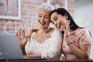 Hi fam. a senior woman using a laptop with her daughter to make a video call at home.