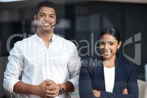 For customer care with a difference. Portrait of two businesspeople standing in a call centre.