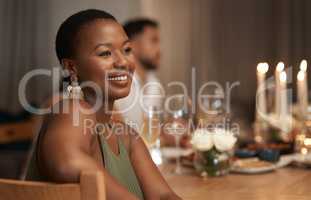 I couldnt have asked for better company tonight. an attractive young woman sitting with her friends during a New Years dinner party.