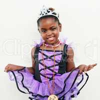 Im a beautiful princess. a little girl wearing a princess costume against a white background.