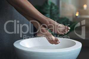 Soak for some softness. Closeup shot of an unrecognisable woman getting a foot treatment at a spa.