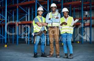 Our combined construction skills give us the competitive edge. Portrait of a group of builders working at a construction site.